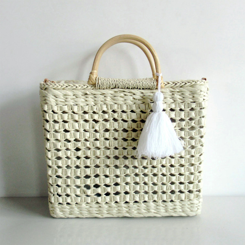 White straw bag with wooden hand